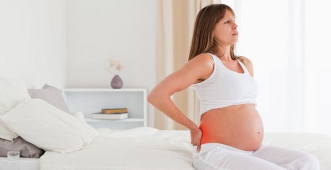 У беременной женщины сильные боли в районе поясницы